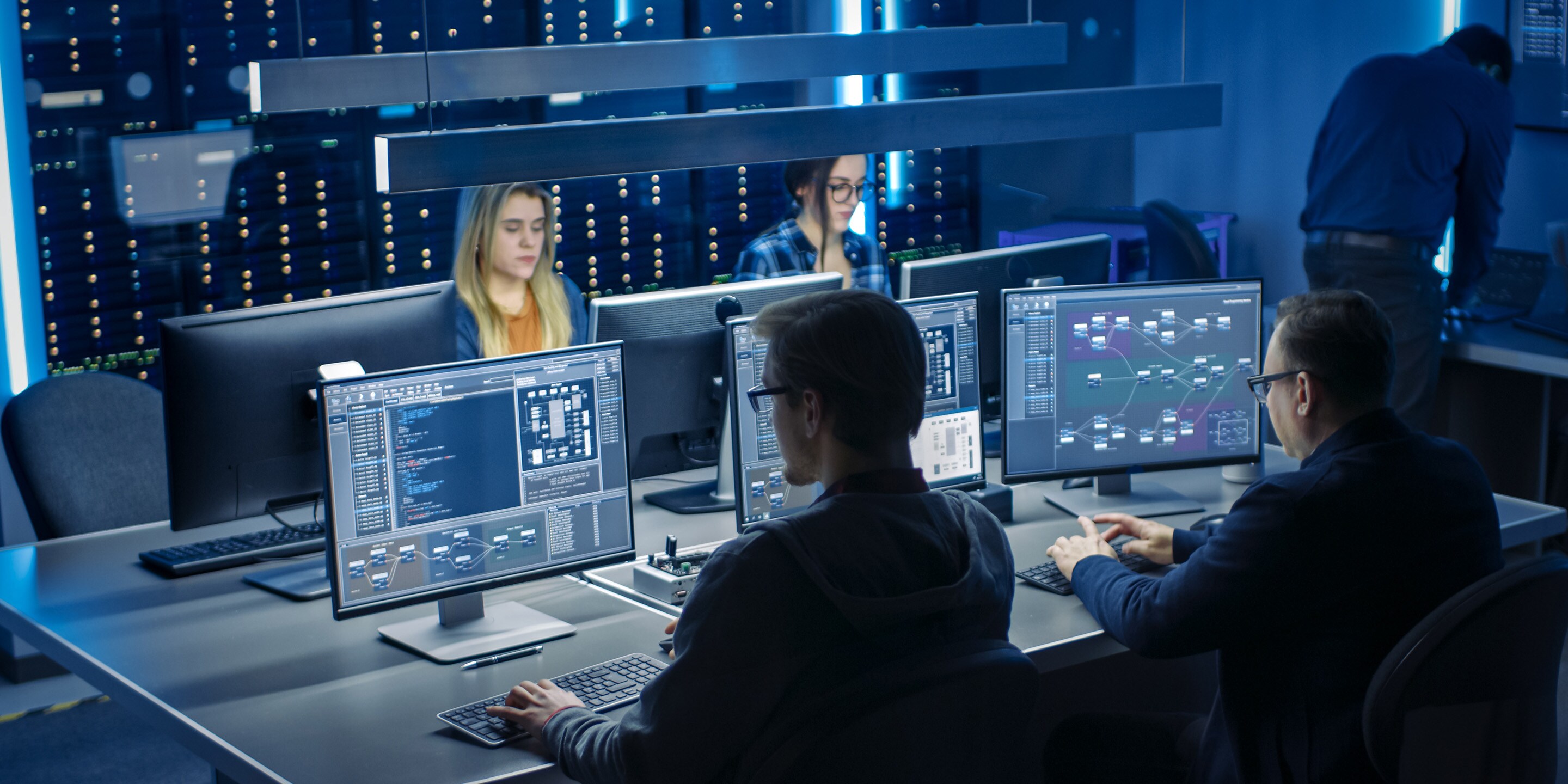 Team of IT Programers Working on Desktop Computers in Data Center System Control Room. Team of Young Professionals Working In Software and Hardware Development, Doing Coding