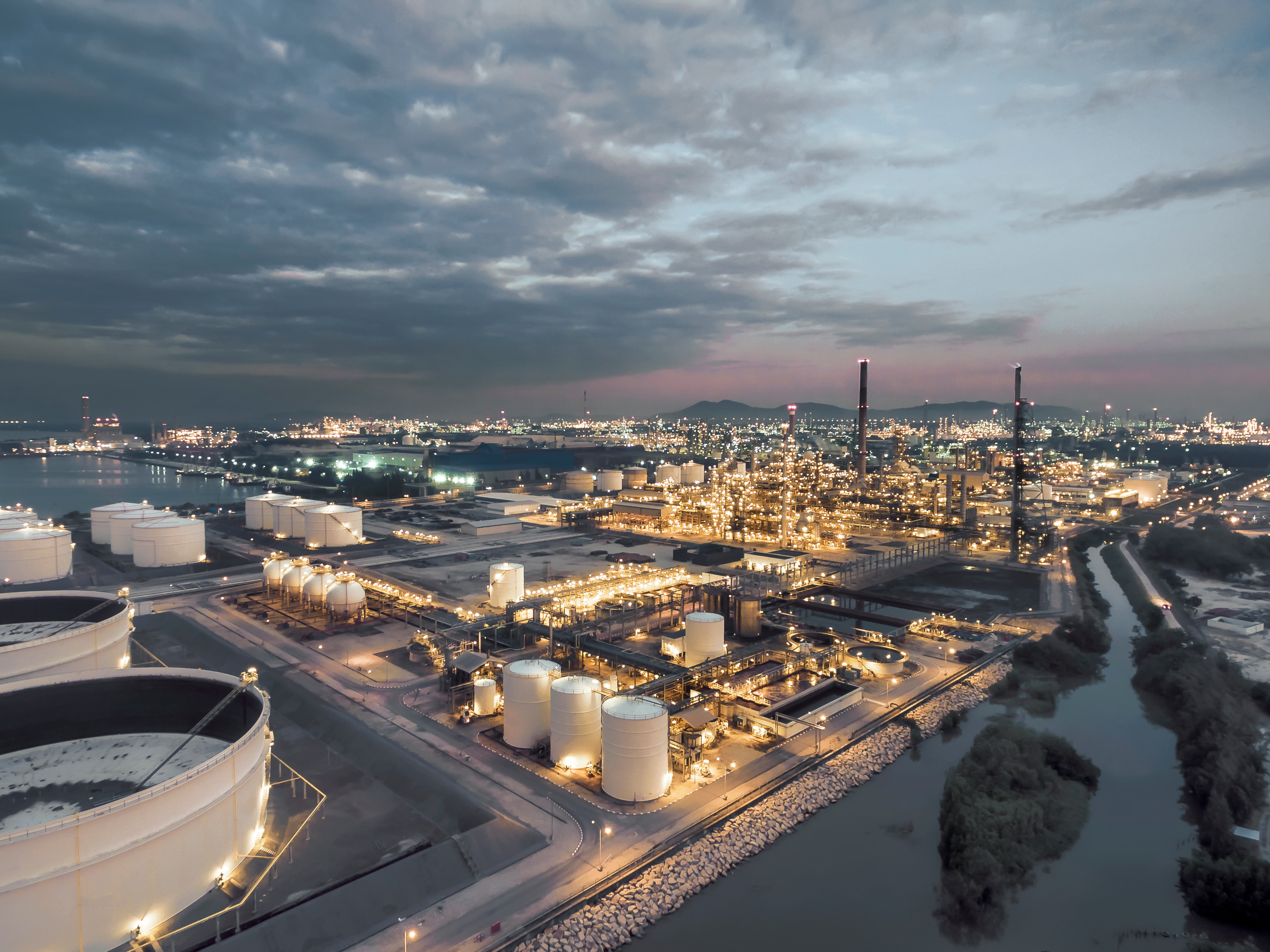 aerial view oil refinery at night, thailand.