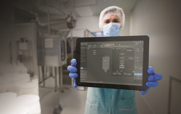 tablet on front, focus on tablet, med worker in blue suit shows empty tablet